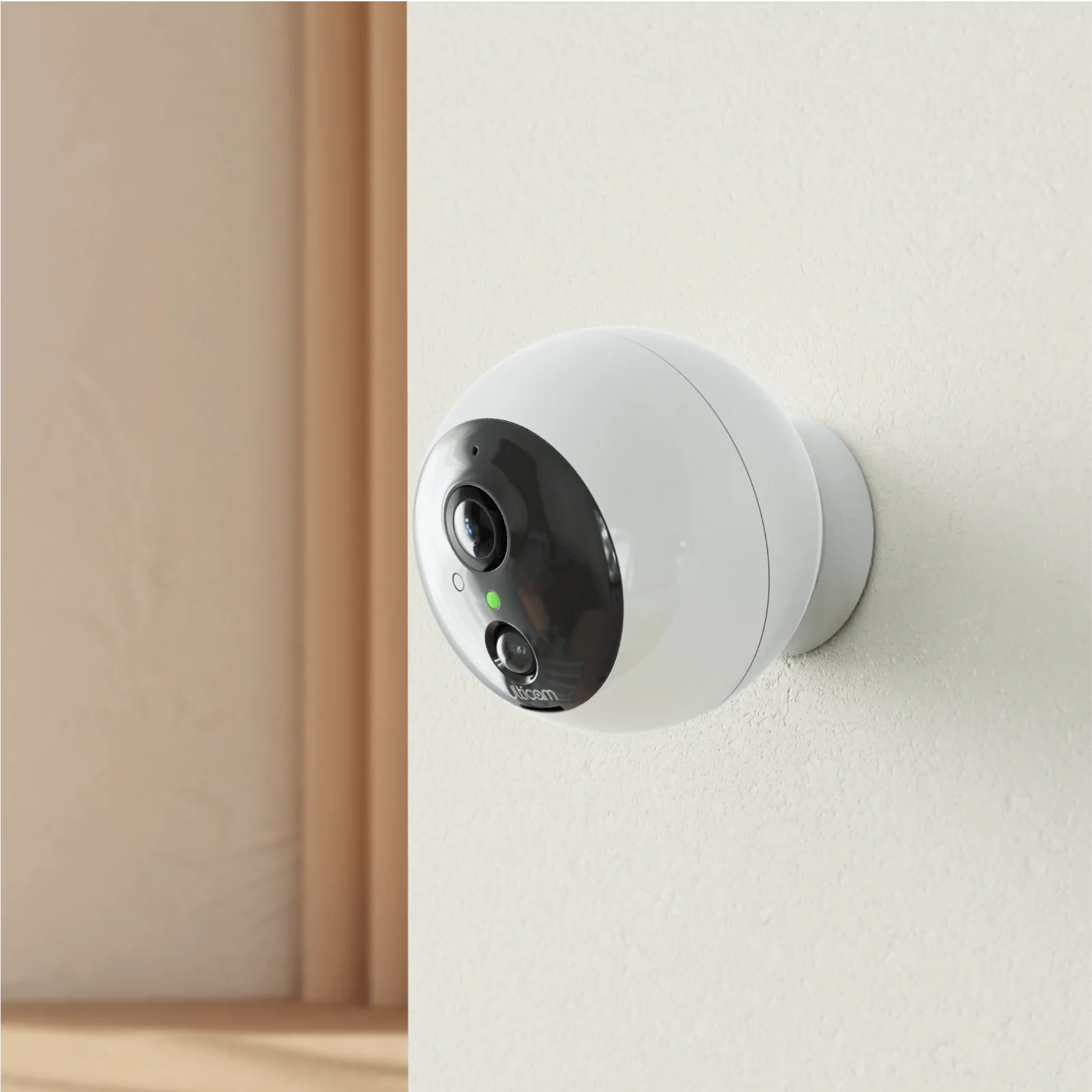 Ulticam Dot indoor smart security camera mounted on wall for home monitoring.