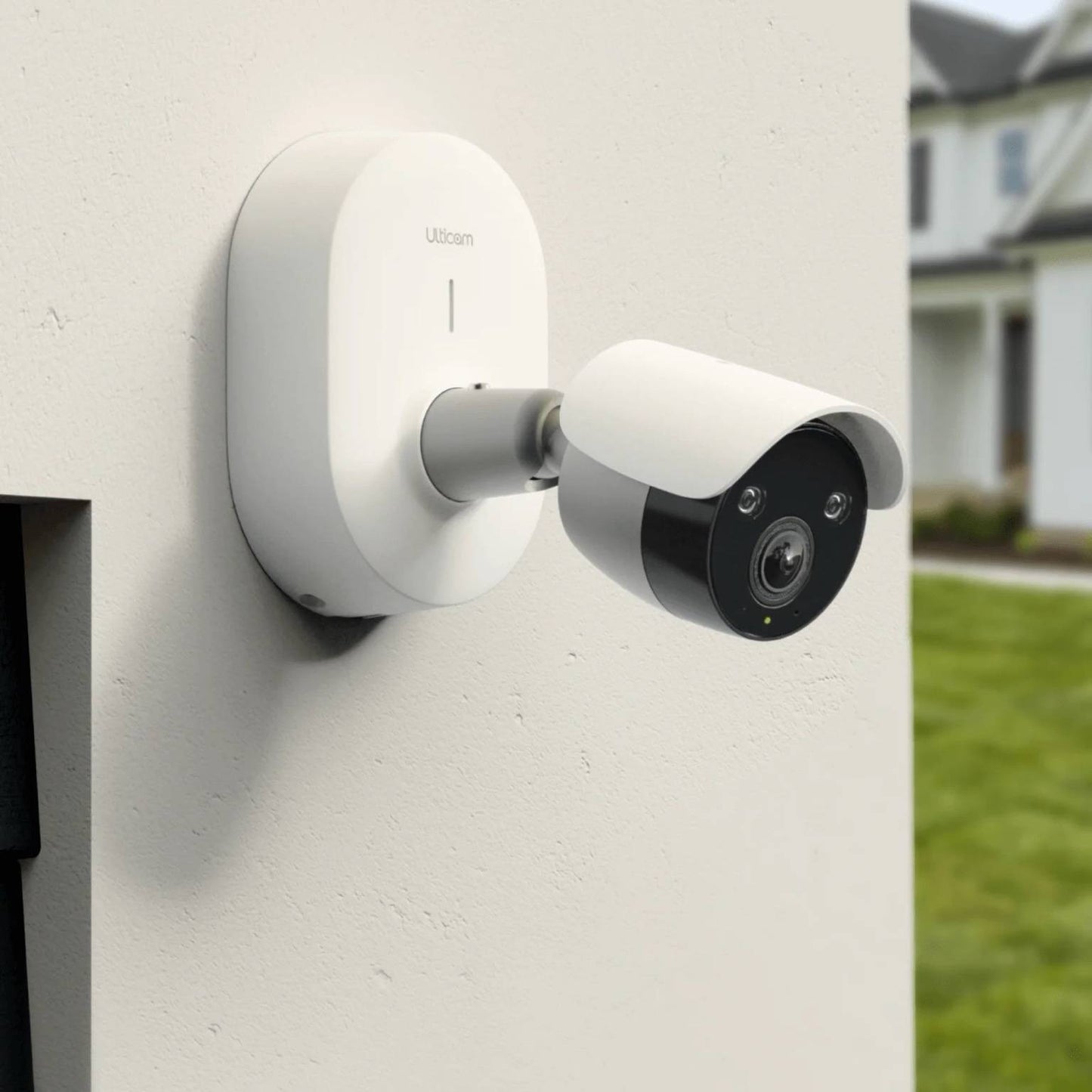 Ulticam IQ 2K UHD Smart Security Camera mounted outdoors on a wall, providing WiFi-enabled surveillance with AI detection and night vision for home security.